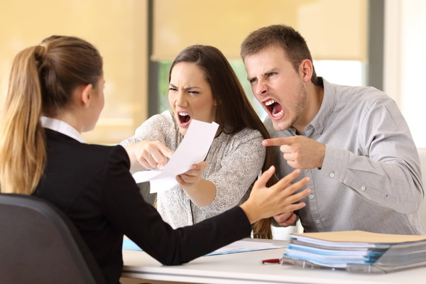 Angry couple claiming at office